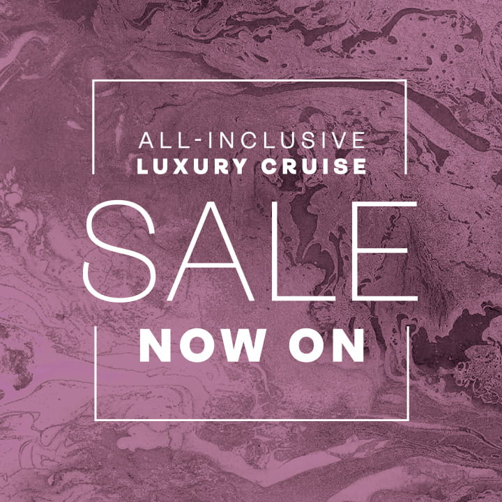 White 'all-inclusive luxury cruise sale now on' text overlaid on a pink marble background